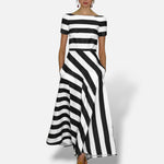 Vestido maxi El Armario de Lola Kelsey com riscas pretas e brancas, corte em A e mangas curtas, estilo elegante.